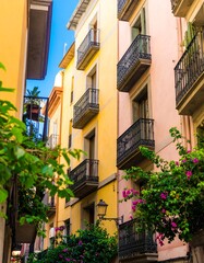 Naklejka premium Colorful European alleyway with balconies