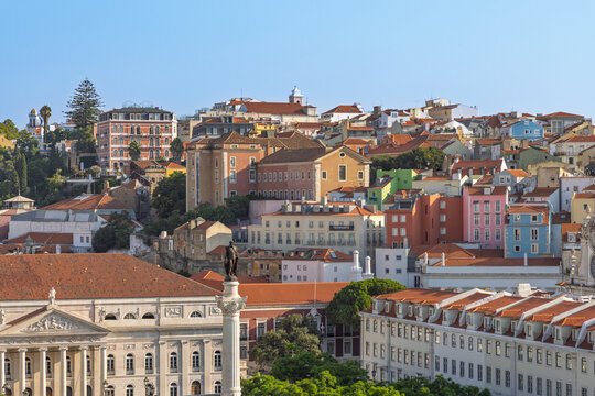 A beautiful panoramic view of Lisbon's colorful residential buildings and terracotta rooftops, capturing the vibrant character and traditional architecture of the city. Lisbon, Portugal. 1 August 2025 - Powered by Adobe
