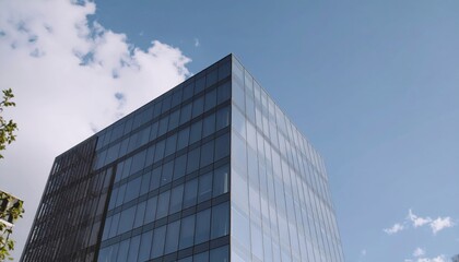 Modern office skyscraper building exterior against blue sky