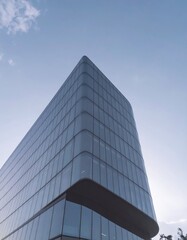 Obraz premium Modern office skyscraper building exterior against blue sky