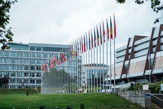 Palais de l Europe building with rows of European Union member state flags outside Council of Europe headquarters Strasbourg France August 19 2025