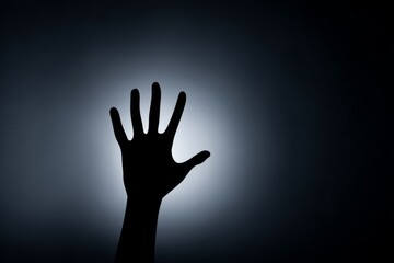 Mysterious Hand Gesture Against Ghostly Background in Shadowy Scene