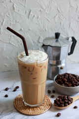 Iced coffee glass with moka pot and roasted coffee bean. Vietnam coffee traditional