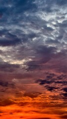 Vivid Red Sunset with Vertical Cloud Glow