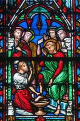 Fototapeta premium Stained glass (19th century) of Jesus Christ washing the Feet of the Apostles.