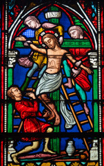 Obraz premium Stained glass (19th century) of The Way of the Cross. Thirteenth station: Jesus' body is taken down from the cross.