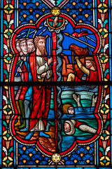 Stained (19th century) glass of Ancient testament: Moses and the crossing of the Red Sea.
