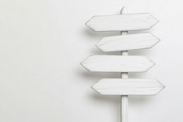 Obraz premium A weathered, blank directional sign against a neutral backdrop offers a minimalist aesthetic. Emphasizing decision-making and guidance, this image can be used for various purposes.