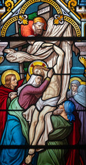 Obraz premium Stained glass (1914) of The Way of the Cross. Thirteenth station: Jesus' body is taken down from the cross.