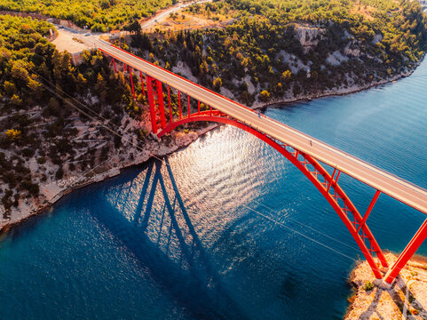  Maslenica Bridge spanning the Novsko zdrilo strait on Croatia&rsquo;s Adriatic coast. Red steel structure  with the turquoise sea and rugged cliffs near Zadar and Paklenica and Velebit national park