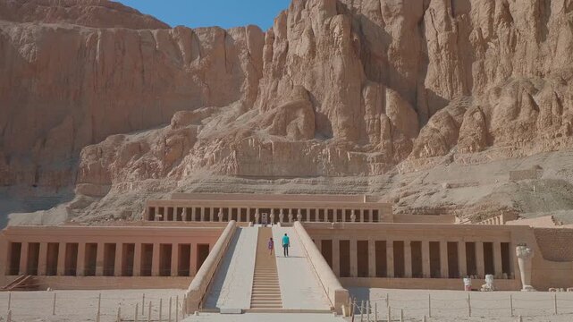 Drone footage captures the awe inspiring Mortuary Temple of Hatshepsut, a masterpiece of ancient Egyptian architecture carved into the cliffs of Deir el Bahari on the West Bank of Luxor.