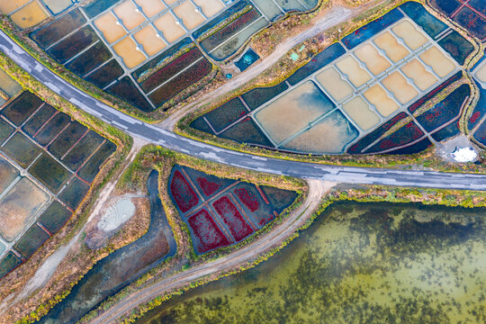 Aerial view of train passing through the salt marshes of Guerande, France