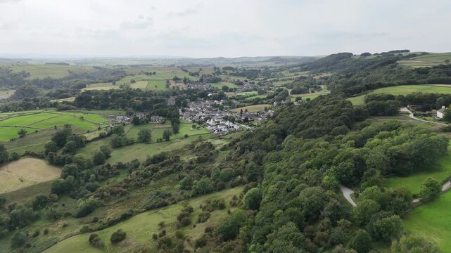 Eyam, The Peak District, England - August 6 2025: Aerial drone footage of the historic Riley Graves in the picturesque countryside of Eyam.