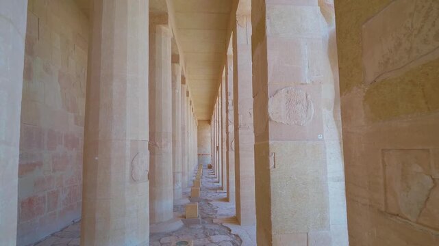 A captivating view inside the Mortuary Temple of Hatshepsut at Deir el Bahari, Luxor, Egypt, showcasing the impressive colonnade and architectural details of this ancient site.