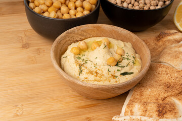 Hummus in bowl, houmous dip, chickpea humus tahini sauce, middle eastern spread