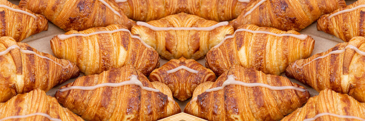 Mini croissant pattern. French puff pastries, chocolat bakery