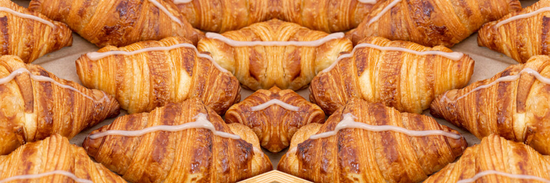 Mini croissant pattern. French puff pastries, chocolat bakery