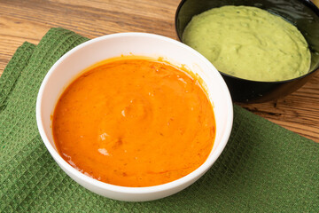 Red mojo rojo and green mojo verde sauces, traditional Tenerife dips, mojo picon dressing