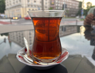 Turkish Tea on a Street Cafe Table, Traditional Arabic Cup in Restaurant, Black Tea Drinking