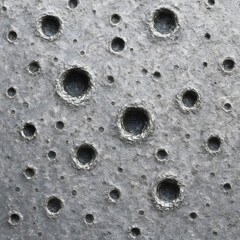 Lunar Surface: A close-up view of the textured lunar surface, marked by craters, evokes the raw power of space. The realistic detail and subtle shadows create an abstract, otherworldly landscape.