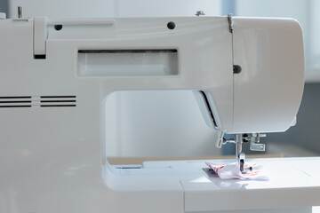Sewing machine in action at a bright crafting space during an afternoon project