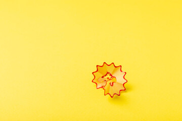 Pencil sharpener on bright colored background. Pencil and pencil shavings. Stationery. School...