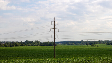Scenic Rural Landscape with Power Lines and Green Fields