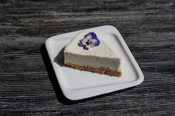 A piece of cheesecake on a white plate. 