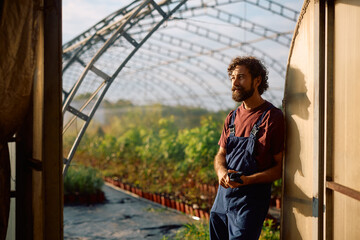 Fototapeta premium Pensive farm owner taking a break from work.