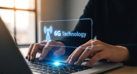 Typing on laptop with a 6g technology graphic overlay showcasing future communication advancements
