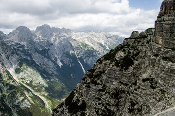 Scenic view from Cez Prag via ferrata into the Vrata Valley in the Julian Alps, Slovenia, dramatic alpine landscape with mountains, cliffs and forests