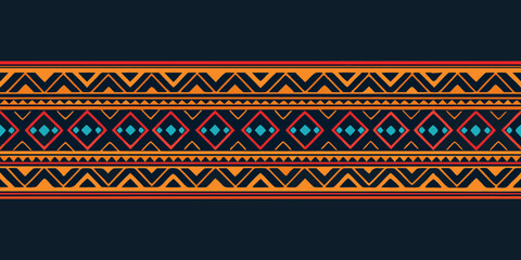 Geometric navajo tribal pattern with diamonds and zigzags in orange red and blue on dark background