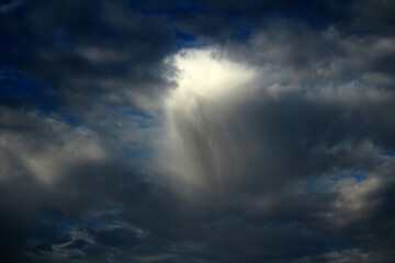 Light breaking through stormy skies