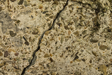 Abstract grunge texture background of cracked concrete. Extreme close-up showing destruction, decay, and the concept of urban brutalism.