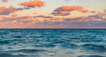 Cloudy sky and seascape at summer vacation. Skyscape with sea horizon. Calm horizon with sea nature. Romantic summer vacation at seascape. Sunset sea and seascape. Sea horizon view. Remote paradise