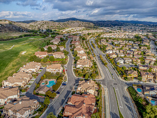 Yorba Linda, Orange County, CA, California, January 25, 2024: Aerial Drone View toward Lakeview Ave including Homes, Houses, Streets with Black Gold Golf Club and Mountain View
