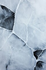 Cracked ice surface with frosty fractures