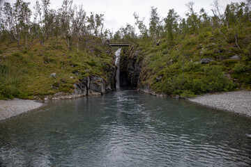 Silverfallet waterfall near the mountain village of Bjorkliden in Kiruna municipality, northern Sweden.
