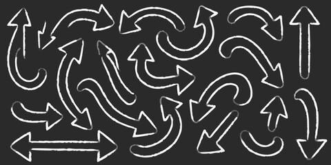Collection of hand drawn chalk style arrows pointing in various directions on a dark background