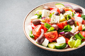 Greek salad with fresh vegetables, cheese and olive oil.