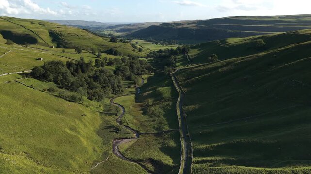 Stunning Aerial View of Kettlewell Village and Rolling Green Landscape in Upper Wharfedale, North Yorkshire, England - Powered by Adobe