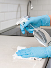 Cleaning a Kitchen Countertop Sanitizing with Spray and Cloth