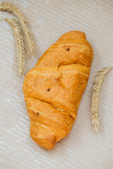 Croissant with rye on table. Kitchen