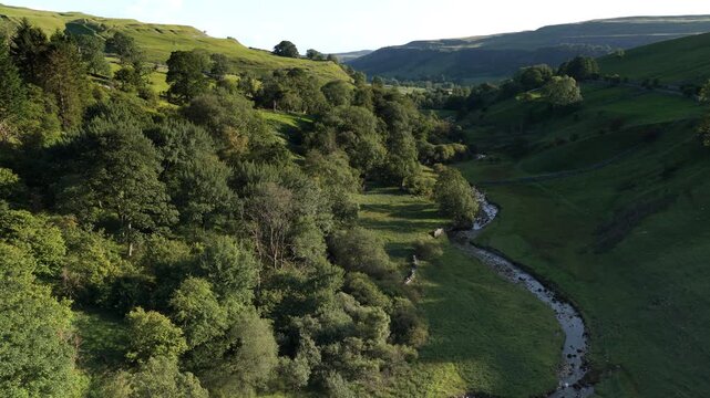 Idyllic Green Valley Landscape with Winding River in Upper Wharfedale, North Yorkshire, England