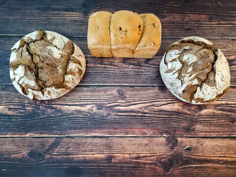 Rustic wooden table with various breads