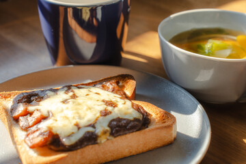Breakfast with cheese toast, vegetable soup, and coffee
