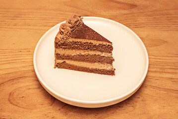 Crispy chocolate cake with hazelnut praline, biscuit base, and nougat ice cream
