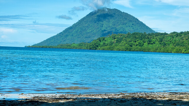 Island Volcano. Exotic islands in the equatorial seas, Sulawesi sea. Indonesia. Indian Ocean.