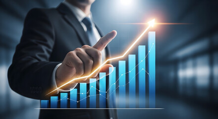 Businessman points to a rising financial graph with an upward trend