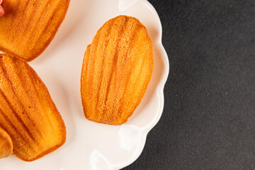 Madeleine cookies sweet dessert traditional french sweets tasty snack fresh delicious gourmet food background on the table rustic top view copy space